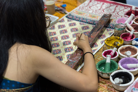 Bangkok, Thailand - June 16, 2018 : Unidentified Thai artist drawing a striped Thai art for making Thai silk design by Ayutthaya traditional contemporary fashionのeditorial素材