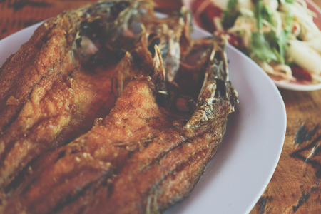 Fried Fish with Fish Sauce or Snapper topped with sauce premium grade is a seafood display for sale...