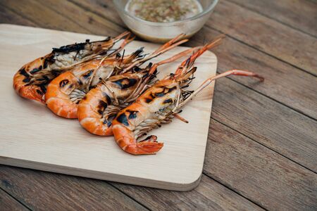 Grilled shrimp (Giant freshwater prawn) grilling with charcoal premium grade display for sale at...