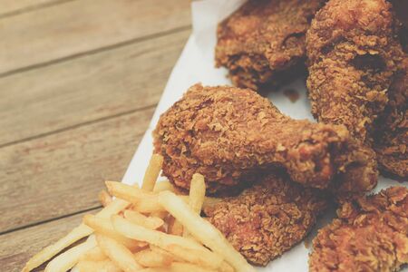 Fried chicken crispy food from chicken and French fries or chips (potato) is a side dish or snack in fastfood restaurant, unhealthy food or fat concept at Thai street food marketの写真素材