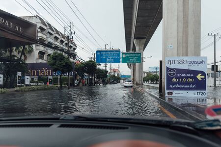 Samut Prakan, Thailand - October 5, 2019 : Water flood in Samut Prakan Province problem with the manhole overflow in drainage system it full from garbage when rain storm.のeditorial素材