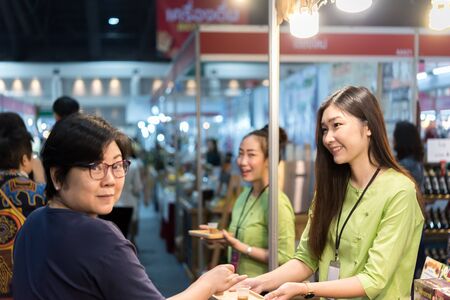 Bangkok, Thailand - December 21, 2019 : Unidentified model pretty lady on display food exhibition show event OTOP. This a open event no need press credentials required.のeditorial素材