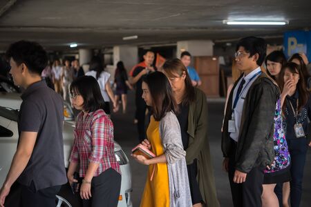 Bangkok, Thailand - December 20, 2019 : Many working people preparedness for fire drill or other...
