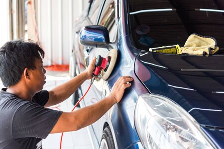 Bangkok, Thailand - November 9, 2019 : Unidentified car care staff cleaning (clean, wash, polish and wax) the car (Car detailing) at car care shop in Bangkok Thailandのeditorial素材