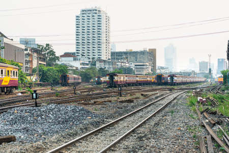 Bangkok, Thailand - January 17, 2020 : Unidentified railway train on the railroad tracks in Bangkok...