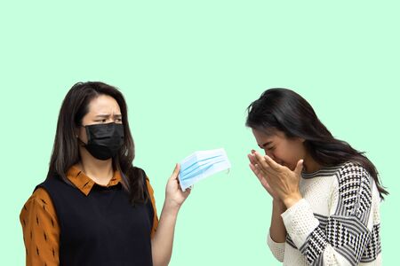 Asian pretty women wearing mask respiratory protection mask against epidemic flu covid19 or corona...