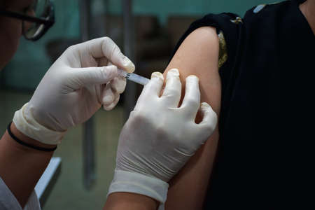 Patient asian woman health check by get vaccinated against the flu covid19 or corona virus every...