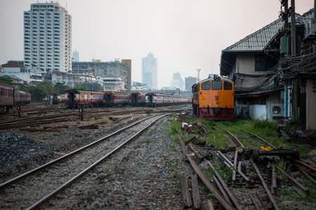 Bangkok, Thailand - January 17, 2020 : Unidentified railway train on the railroad tracks in Bangkok...