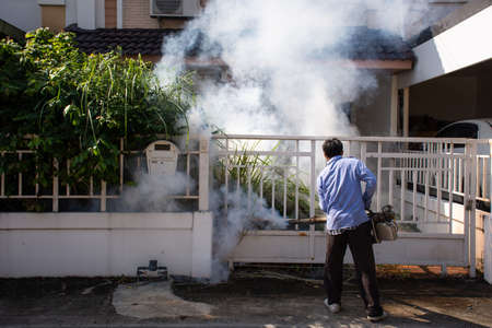 Bangkok, Thailand - November 19, 2016 : Unidentified people fogging DDT spray for mosquito kill and protect by control mosquito is a carrier of Malaria, Encephalitis, Dengue and Zika virus in village.のeditorial素材