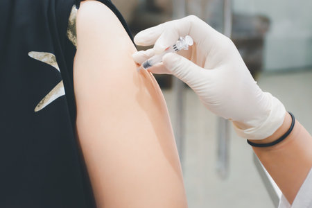 Patient asian woman health check by get vaccinated against the flu covid19 or corona virus every year by the Ministry of Health at hospital in concept illness, outbreak, healthcare in lifeの写真素材