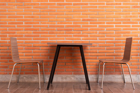Cafe or restaurant in balcony view decorate with red brick wall and table chairs set for seating...