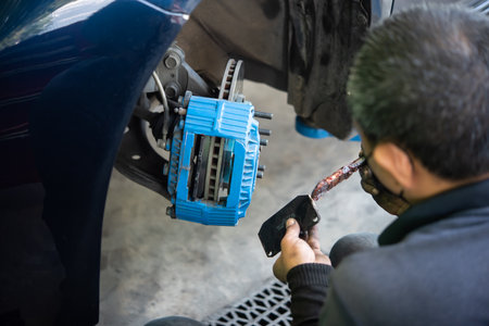 Bangkok, Thailand - January 16, 2022 : Unidentified car mechanic or serviceman disassembly and...