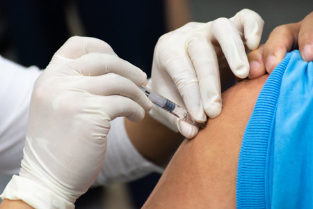 Patient asian woman health check by get vaccinated against the flu covid19 or corona virus every year by the Ministry of Health at hospital in concept illness, outbreak, healthcare in lifeの写真素材