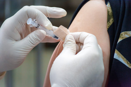 Patient asian woman health check by get vaccinated against the flu covid19 or corona virus every year by the Ministry of Health at hospital in concept illness, outbreak, healthcare in lifeの写真素材