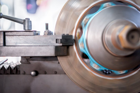 Car mechanic or serviceman disassembly and checking a disc brake for fix and repair problem at car...