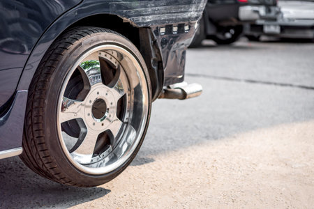 Denter or car mechanic serviceman check and fix body work and fiber bumper body part for fix and repair problem at car garage or repair shopの写真素材