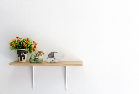 Decorated interior on shelf,  put on ceramic elephant and flowerの写真素材