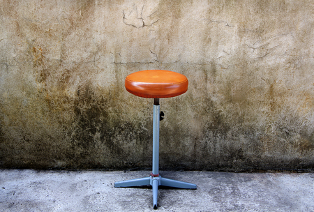 bar stool with old wall backgroundの写真素材