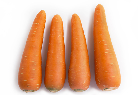 Fresh carrots isolated on white background. Closeup of carrot.