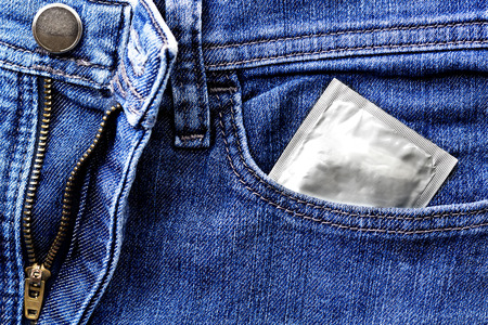 Condoms in the blue jeans pocket.Safe sex conceptの写真素材