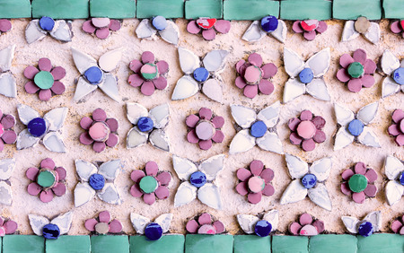Wall decorative with a flower made of Earthenware multicolor and white mosaic, Abstract background...