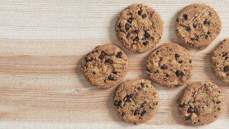 Chocolate chip cookies on the wood table. Copy space for your text or image.