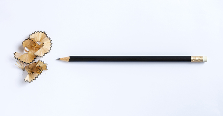A pencil and a piece of a pencil on white paper background. Copy space for your text or image.の写真素材