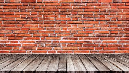 Brick wall and floors are made of wood. The empty room is used for decorating or displaying work.の写真素材