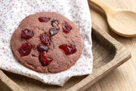 Mixed fruits and gaba riceberry cookie isolated on wood table. Delicious homemade baked cookie.の写真素材
