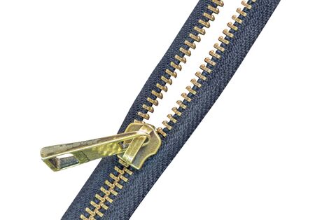 Old brass zipper isolate on a whiteの写真素材