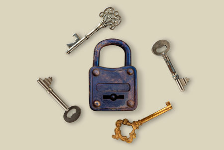 Several types of keys and master keys are on a gray background. The concept about finding the key to...