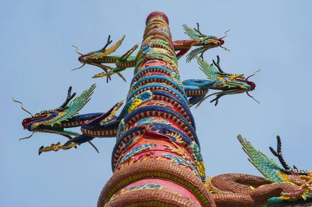 Golden dragon with clouds blue sky at chinese temple,Thailandの写真素材