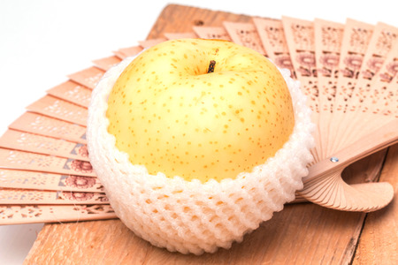 Apple pears in packing protective netの写真素材