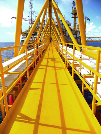 Offshore oil and gas central process, Walking bridge link oil to gas platform, Petroleum industry.