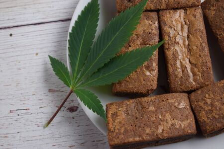 Brownies and cannabis leaf.の写真素材