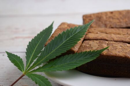 Brownies and cannabis leaf.の写真素材