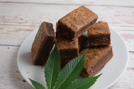 Brownies and cannabis leaf.の写真素材