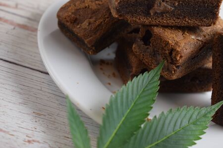 Brownies and cannabis leaf.の写真素材