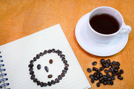 coffe in white cup with round faceの写真素材