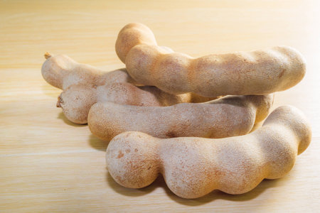 brown tamarind on table for food ingredientの写真素材