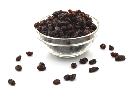 Black raisins on a white backgroundの写真素材