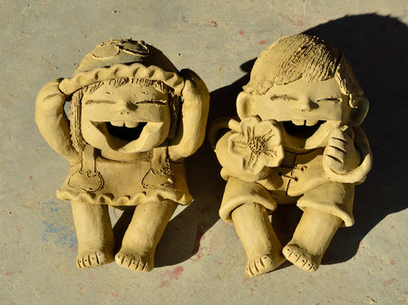 Doll children made of clay moldingの写真素材