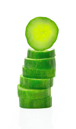 Fresh cucumber slice isolated on white background の写真素材