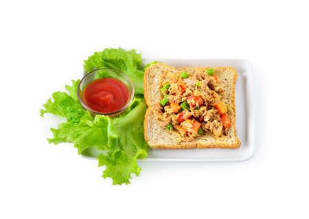 Tuna bread with tomato sauce on white backgroundの写真素材