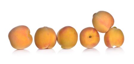 Fresh peaches isolated on white