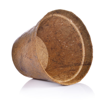 Biodegradable plant pot made from coconut husk on white backgroundの写真素材