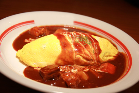 japanese curry rice with omelet and porkの写真素材