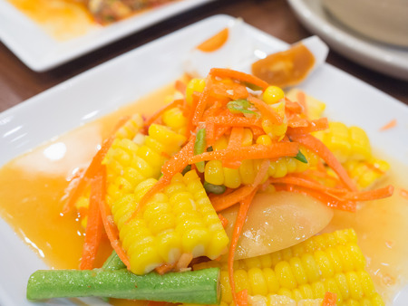 thai spicy salad made by carrot, corn bean and eggの写真素材