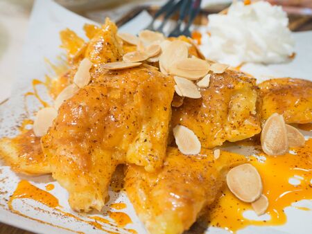 thai tea roti with whip creamの写真素材