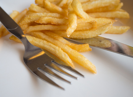 french fried with forkの写真素材